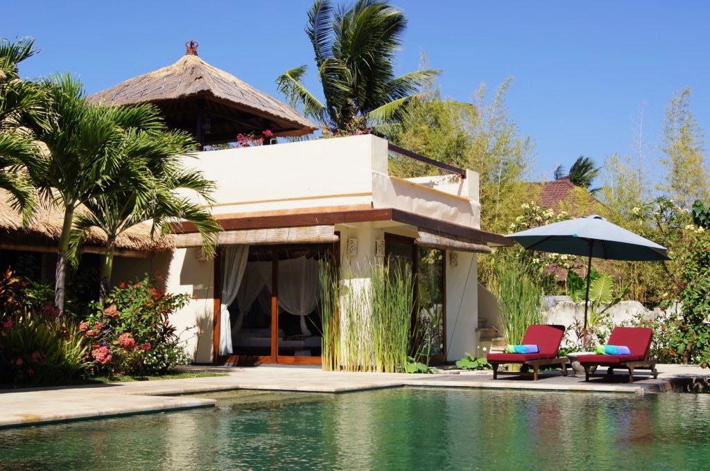 Bedroom with sea and pool view